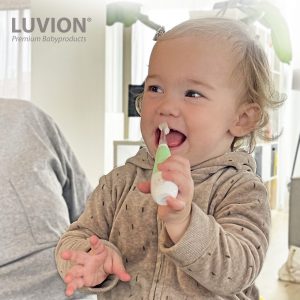toddler with sonic electric baby toothbrush