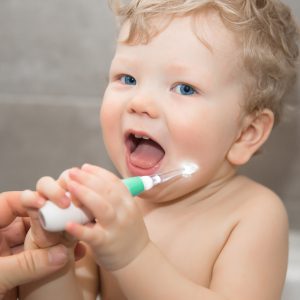 baby with luvion sonic electric baby toothbrush